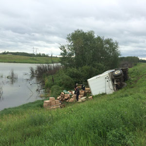 Tipped truck with cargo spilled out